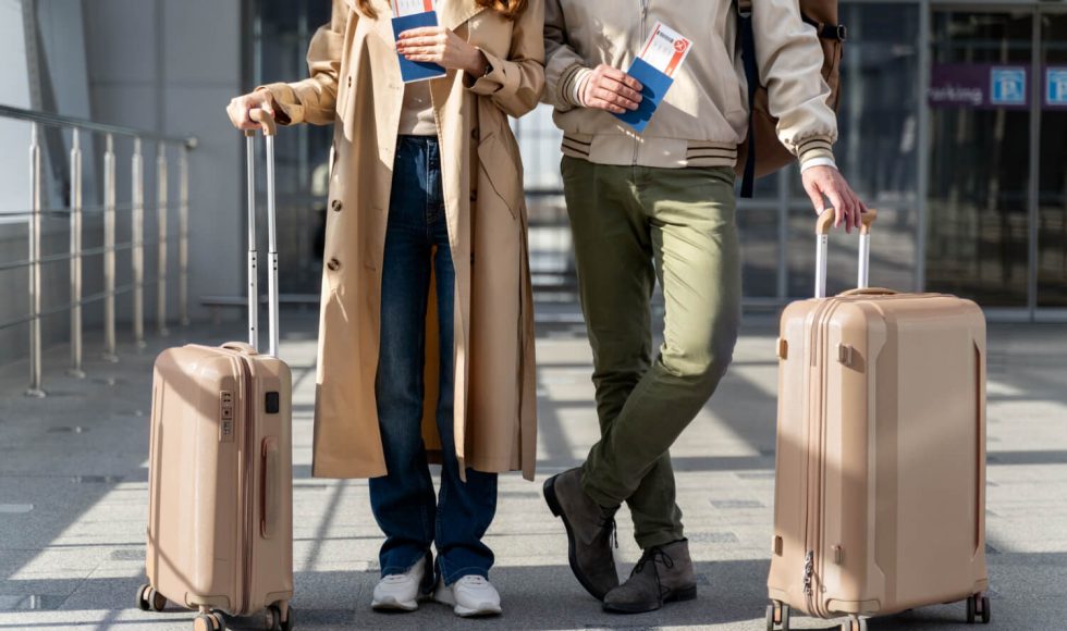 two people mopving abroad with their loads and passport