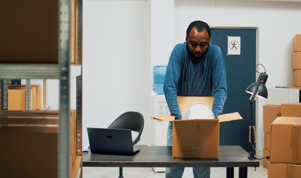 a man packing things in his office